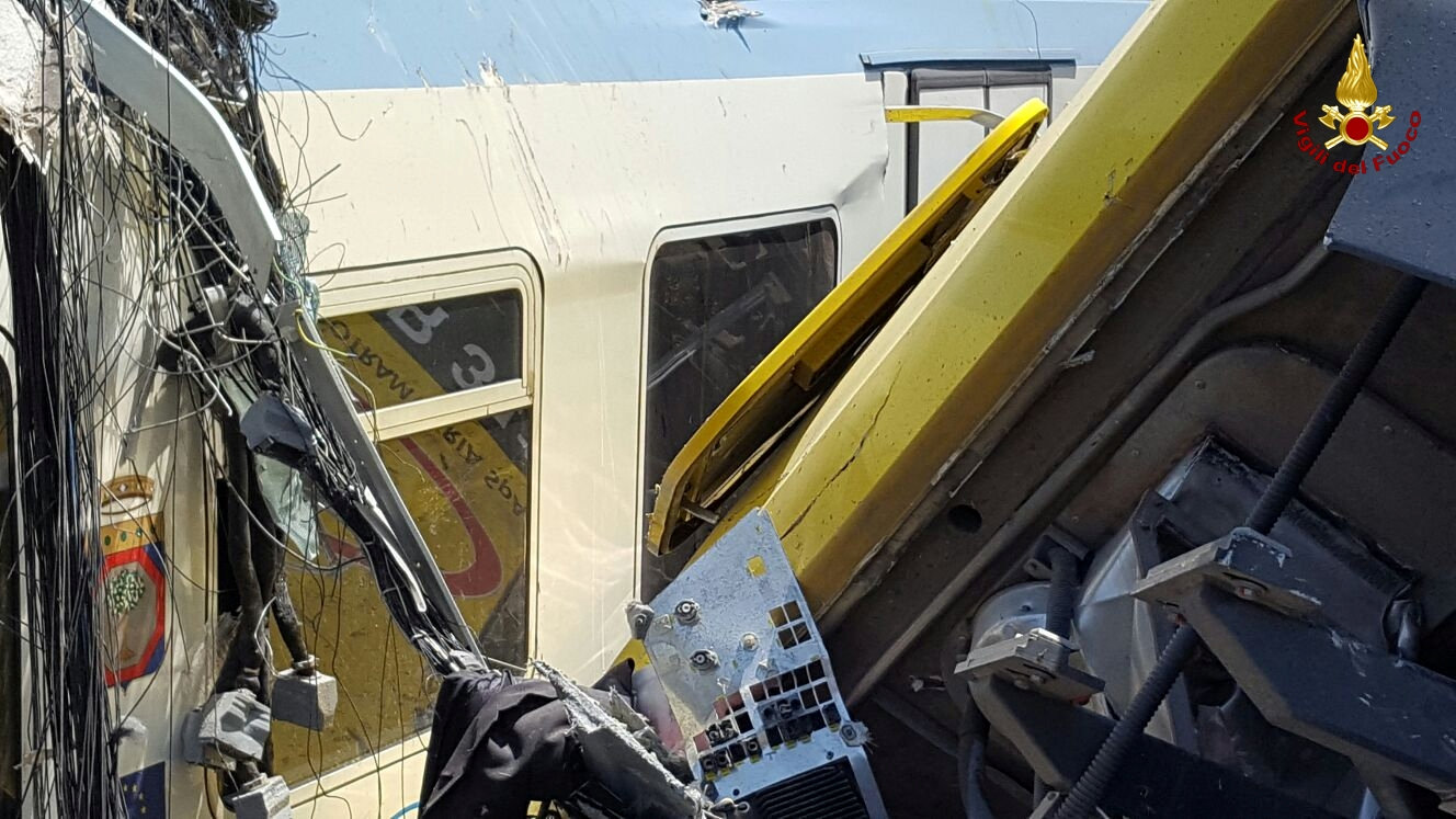 Two passenger trains are seen after a collision in the middle of an olive grove in the southern village of Corato, near Bari, Italy, in this handout picture released by Italian Firefighters July 12, 2016. Italian Firefighters/Handout via Reuters ATTENTION EDITORS - THIS PICTURE WAS PROVIDED BY A THIRD PARTY. FOR EDITORIAL USE ONLY.