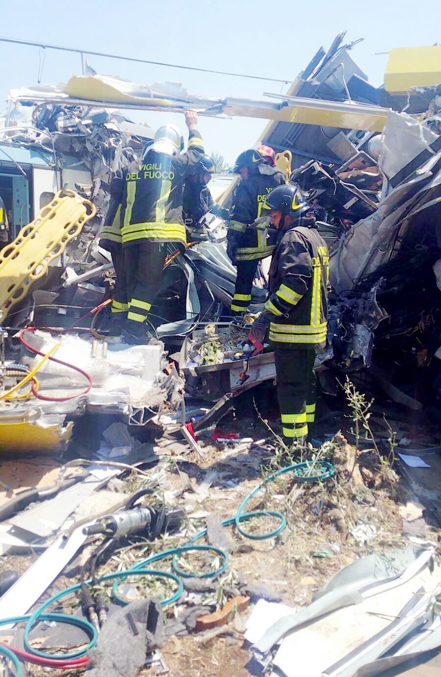 epa05421610 A handout picture provided by the Italian Fire Brigade on 12 July 2016 shows emergency services working at the crash site where two trains collided on a single-track stretch between Ruvo di Puglia and Corato, southern Italy, 12 July 2016. A least ten people have been killed and dozens injured according to reports. EPA/ITALIAN FIRE BRIGADE / HANDOUT HANDOUT EDITORIAL USE ONLY/NO SALES HANDOUT EDITORIAL USE ONLY/NO SALES