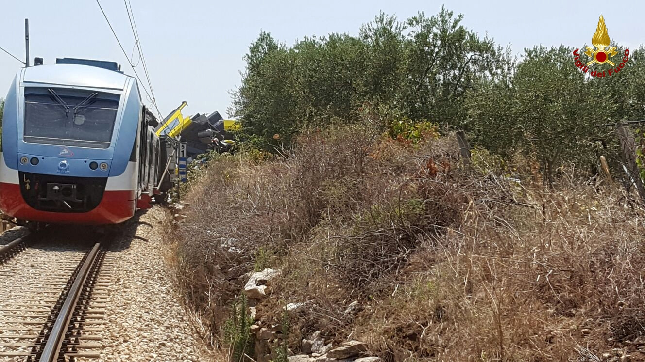 Two passenger trains are seen after a collision in the middle of an olive grove in the southern village of Corato, near Bari, Italy, in this handout picture released by Italian Firefighters July 12, 2016. Italian Firefighters/Handout via Reuters ATTENTION EDITORS - THIS PICTURE WAS PROVIDED BY A THIRD PARTY. FOR EDITORIAL USE ONLY.