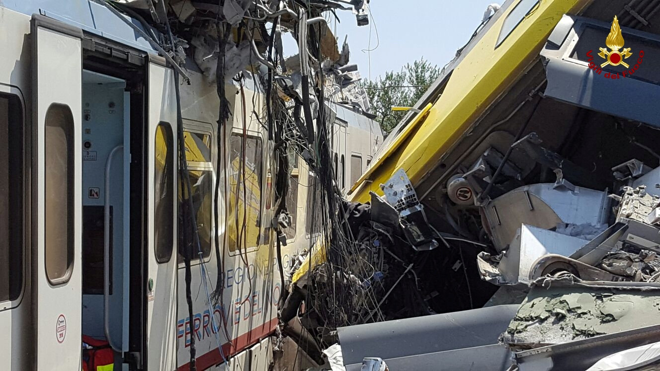 Two passenger trains are seen after a collision in the middle of an olive grove in the southern village of Corato, near Bari, Italy, in this handout picture released by Italian Firefighters July 12, 2016. Italian Firefighters/Handout via Reuters ATTENTION EDITORS - THIS PICTURE WAS PROVIDED BY A THIRD PARTY. FOR EDITORIAL USE ONLY.