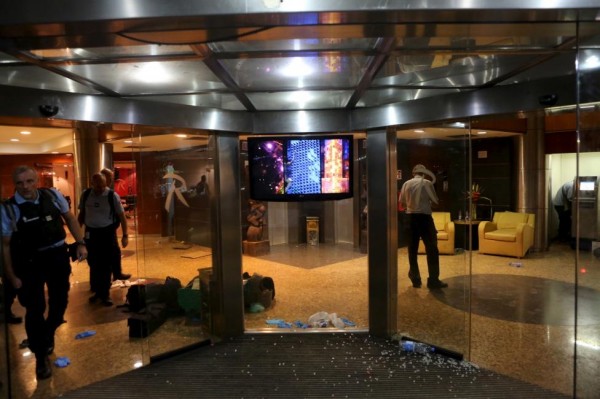 UN officials exit the Radisson hotel in Bamako