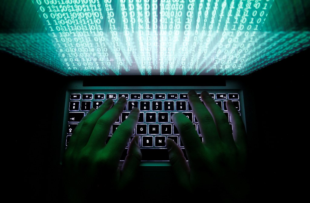 A man types on a computer keyboard in Warsaw in this February 28, 2013 illustration file picture. One of the largest ever cyber attacks is slowing global internet services after an organisation blocking "spam" content became a target, with some experts saying the disruption could get worse.        To match INTERNET-ATTACK/      REUTERS/Kacper Pempel/Files (POLAND - Tags: BUSINESS SCIENCE TECHNOLOGY)