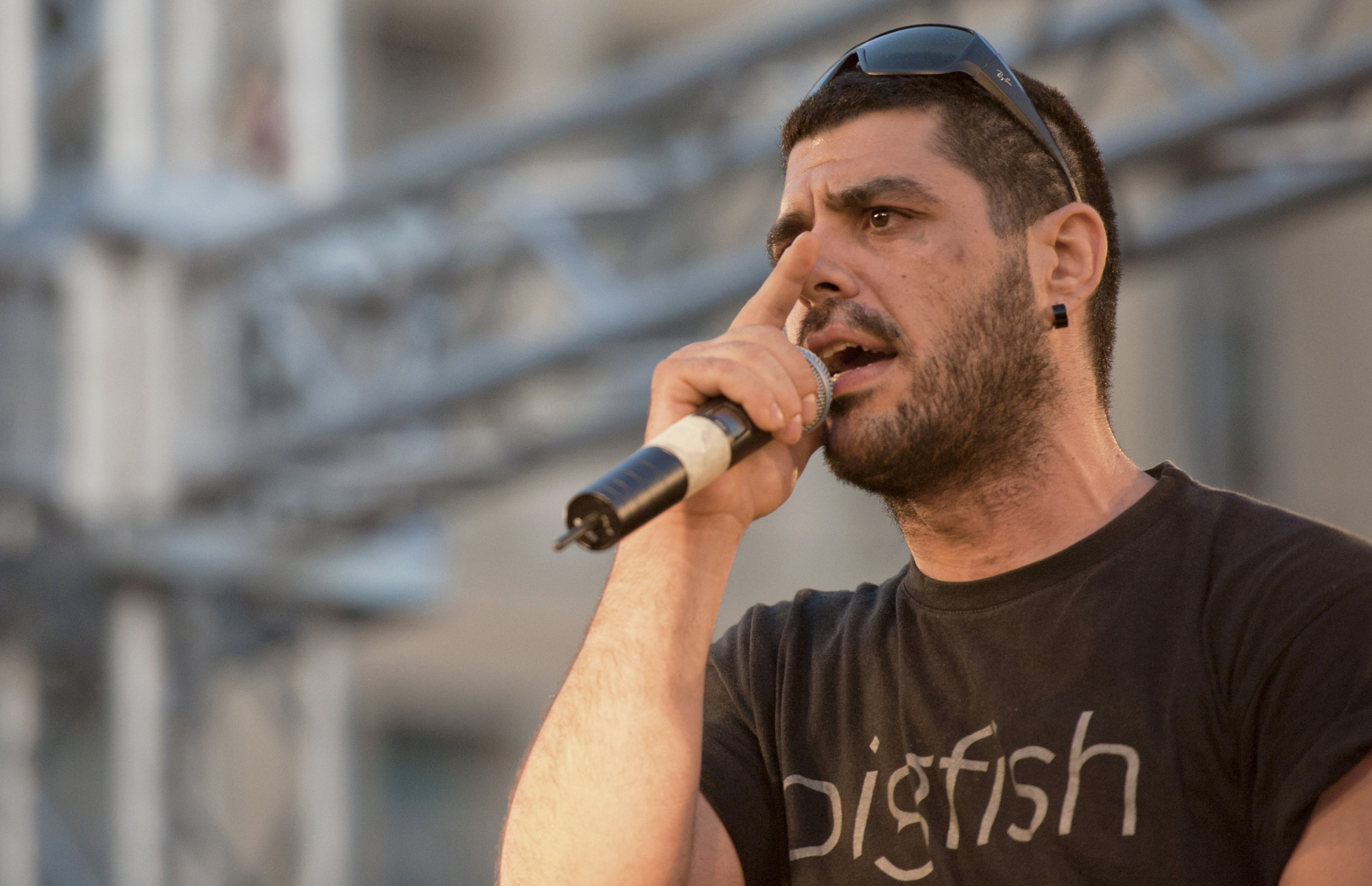 In this photo dated June 21, 2011, rapper Pavlos Fyssas performs on stage. Fyssas, a hip-hop singer with the stage name Killah P and described as an anti-fascist activist, died early Wednesday Sept 18 from two stab wounds to the chest after leaving a cafe in the western area of Keratsini. Police arrested a suspect at the scene, who they say admitted to the killing and identified himself as a member of Golden Dawn. (AP Photo/John D. Carnessiotis)