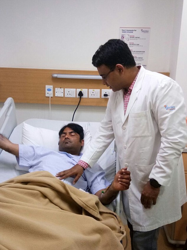 UTTAR PRADESH, INDIA- MARCH 03, 2017: Ved Prakash, 31, being examined by Dr Saurabh Gupta, at Jaypee Hospital in Ghaziabad in Uttar Pradesh, India. Rita slashed her husband's genitals because he refused to have sex with her for ten years. Ved was rushed to nearby Jaypee Hospital. Dr. Saurabh Gupta, Plastic Surgeon, rettached his penis in a five-hour long surgery and is currently out of danger. Pictures supplied by: Cover Asia Press