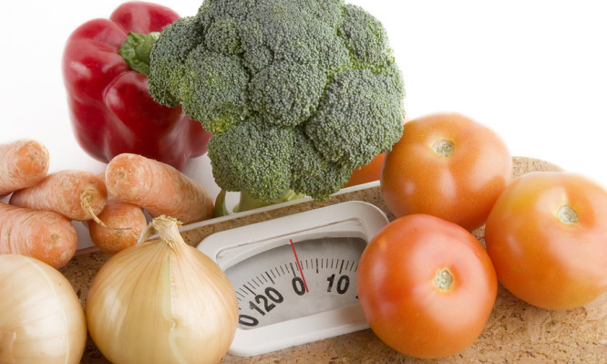 garden vegetables on a bathroom scale