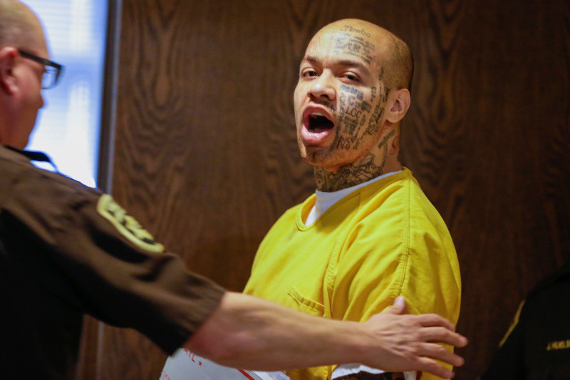 FILE- In this April 16, 2014 file photo, Nikko Jenkins is led to court by a Douglas County deputy in Omaha, Neb. Jenkins, convicted of killing four people in and around Omaha in 2013, has been sentenced to execution or life in prison. Jenkins' sentencing has been delayed several times because of questions about his competency. A  three-judge panel will announce on Tuesday, May 30, 2017, whether Jenkins is sentenced to death or to life in prison. (AP Photo/Nati Harnik)