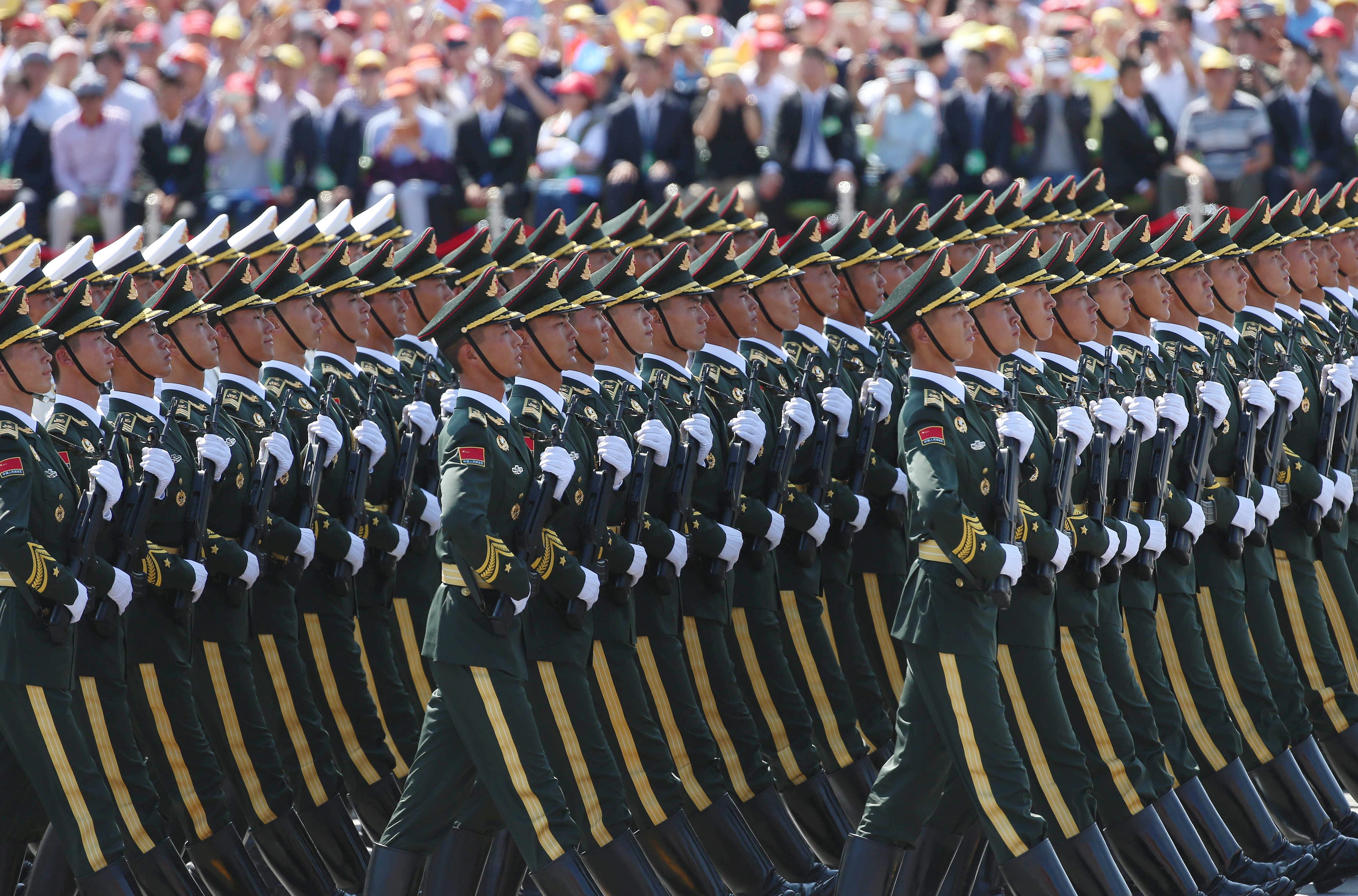 epa04909991 Chinese People's Liberation Army (PLA) soldiers march on Tiananmen Square during the military parade marking the 70th Anniversary of the Victory of Chinese People's Resistance against Japanese Aggression and World Anti-Fascist War at Tiananmen Square in Beijing, China, 03 September 2015. China holds a military parade on 03 September, as one of the events taking place around the World marking the 70th Anniversary of the WWII Victory over Japan Day which marks the day Japan officially accepted the terms of surrender imposed by the by Allied Forces in the Pacific conflict.  EPA/WU HONG