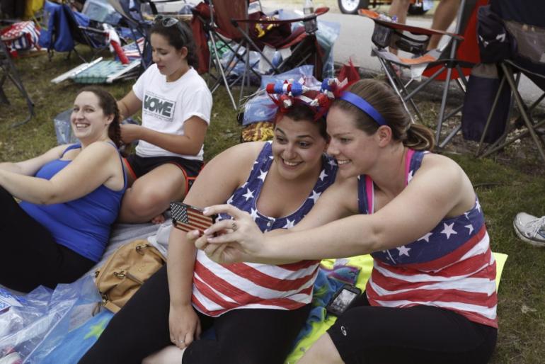 448700-megan-oniell-and-jackie-pugsley-r-snap-a-selfie-with-an-american-flag-