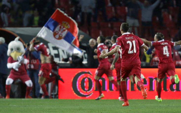 Serbia's Aleksandar Prijovic, left, is chased by his teammates after scoring the first goal of his team during their World Cup Group D qualifying soccer match between Serbia and Georgia at the Rajko Mitic stadium in Belgrade, Serbia, Monday, Oct. 9, 2017. (AP Photo/Darko Vojinovic)