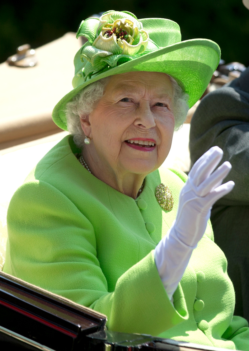 Britain's Queen Elizabeth II, waves to the crowd as she arrives by open carriage to the parade ring on the first day o the Royal Ascot horse race meeting in Ascot, England, Tuesday, June 20, 2017. (AP Photo/Alastair Grant)