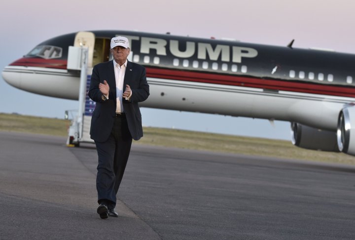 Republican presidential nominee Donald Trump walks across the tarmac as he arrives for a rally at the JetCenters of Colorado in Colorado Springs, Colorado on September 17, 2016. / AFP / MANDEL NGAN        (Photo credit should read MANDEL NGAN/AFP/Getty Images)