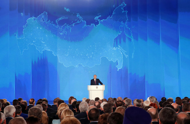 Russian President Vladimir Putin addresses the Federal Assembly, including the State Duma parliamentarians, members of the Federation Council, regional governors and other high-ranking officials, in Moscow, Russia March 1, 2018. REUTERS/Maxim Shemetov     TPX IMAGES OF THE DAY