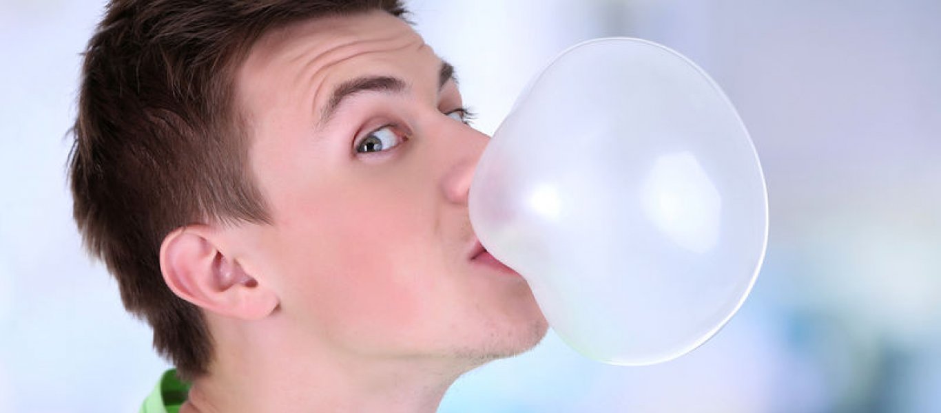 man-blowing-bubble-of-ch-58995743