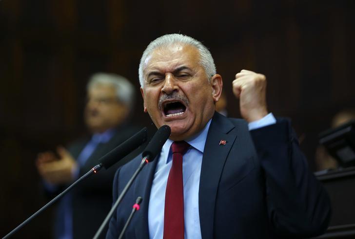 Turkey's Prime Minister Binali Yildirim addresses members of parliament from his ruling AK Party (AKP) during a meeting at the Turkish parliament in Ankara, Turkey July 19, 2016.     REUTERS/Umit Bektas