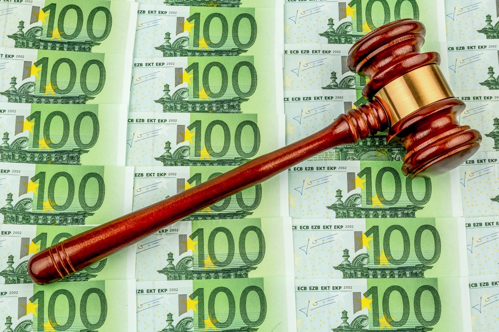 gavel and euro banknotes. symbol photo for costs in court, rule of law and auctions