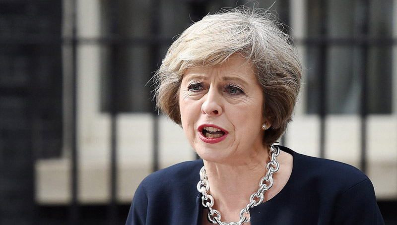 epa05423477 New British Prime Minister Theresa May addresses the media upon their arrival at No. 10 Downing Street, in London, Britain, 13 July 2016. Theresa May has become Britain's Prime Minister - succeeding David Cameron - after a meeting with the Queen and will begin building a new cabinet.  EPA/ANDY RAIN