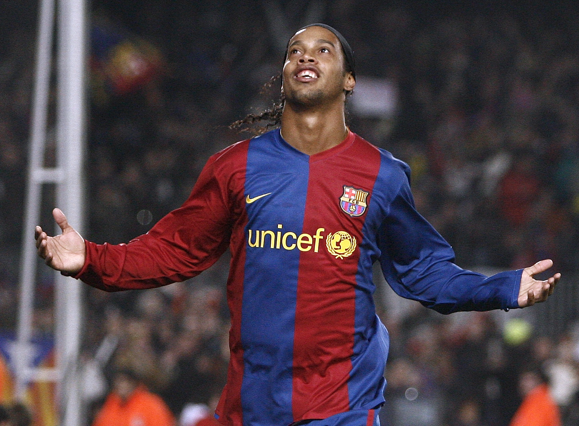 Barcelona player Ronaldinho celebrates his goal against Celta Vigo during his Spanish league soccer match at Camp Nou Stadium in Barcelona, Spain, Sunday, Jan. 28, 2007. (AP Photo/Manu Fernandez)