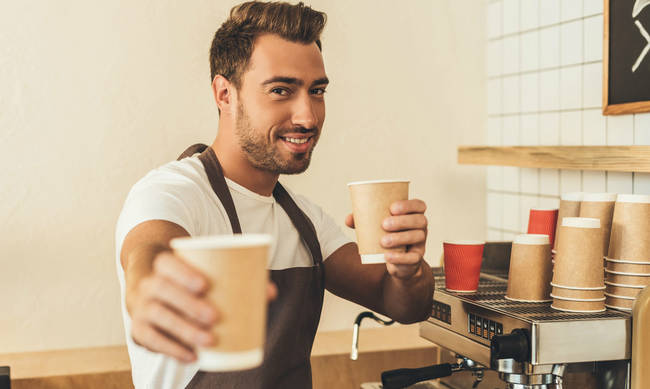 bigstock-Barista-Showing-Coffee-To-Go-204808966