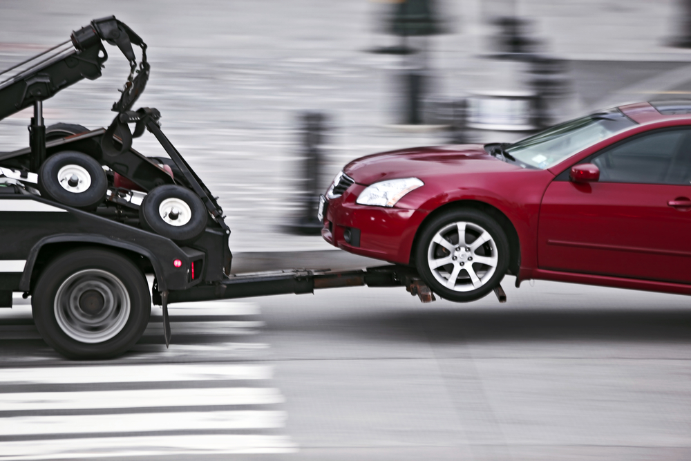 police department tow truck delivers the damaged vehicle