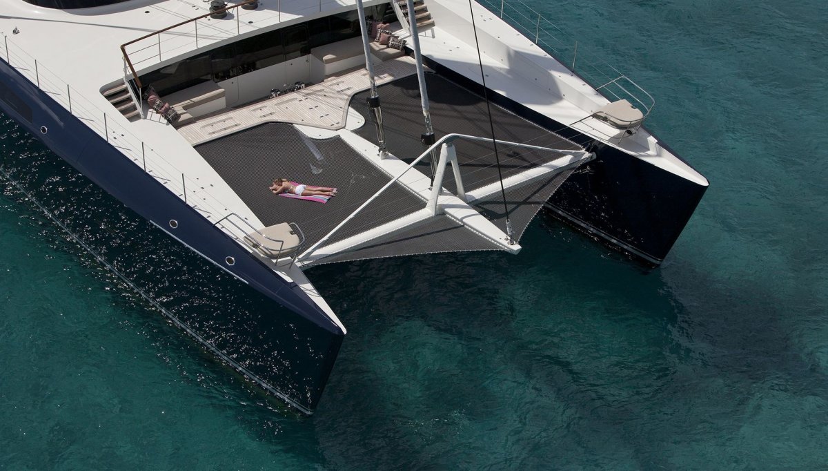 because-the-hemisphere-is-a-catamaran-it-has-an-unusual-feature-there-is-a-48-meter-trampoline-on-the-front-which-can-also-double-as-a-calm-place-to-relax-suspended-above-the-water