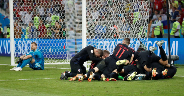 Soccer Football - World Cup - Quarter Final - Russia vs Croatia - Fisht Stadium, Sochi, Russia - July 7, 2018  Croatia's Ivan Rakitic celebrates with team mates after scoring the deciding penalty during the shootout  REUTERS/Maxim Shemetov