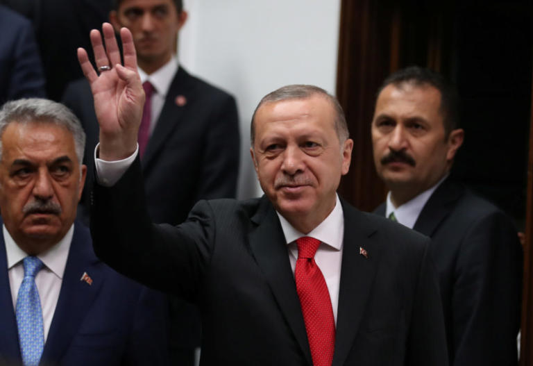 Turkish President Tayyip Erdogan greets members of parliament from his ruling AK Party (AKP) as he arrives at the Turkish parliament in Ankara, Turkey, July 7, 2018. REUTERS/Umit Bektas