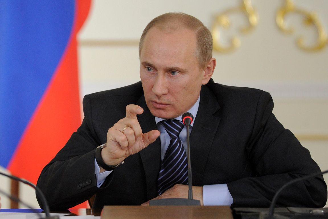 Russian Prime Minister Vladimir Putin gestures while speaking during a meeting in the Novo-Ogaryovo residence outside Moscow, Friday, April 28, 2012. Putin offered to encourage the regions to develop the infrastructure of land plots, which were allocated for large families. (AP Photo/RIA-Novosti, Yana Lapikova, Government Press Service)