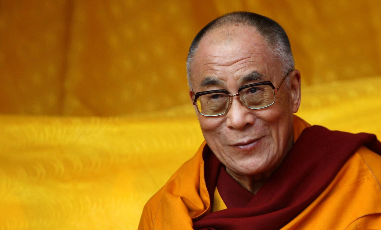 FILE PHOTO: Tibetan spiritual leader the Dalai Lama watches a dance performance on the last day of his teachings in Tawang in the northeastern Indian state of Arunchal Pradesh November 11, 2009.   REUTERS/Adnan Abidi/File Photo