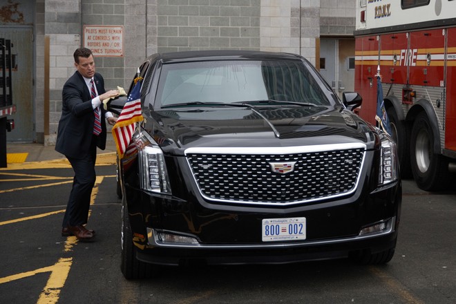 In this Sept. 23, 2018, photo, a Secret Service agent cleans the presidential limousine before the arrival of Marine One carrying President Donald Trump at the Downtown Manhattan Heliport in New York. (AP Photo/Evan Vucci)