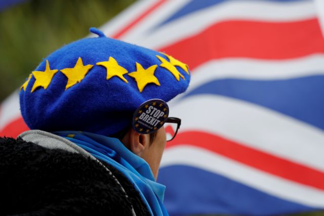 A man wears a beret designed to resemble the EU flag during an anti-Brexit demonstration on the first day of the Conservative Party Conference in Birmingham, Britain, September 30, 2018. REUTERS/Darren Staples