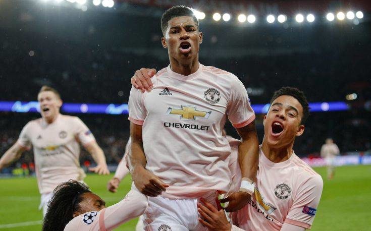 ManU's Marcus Rashford , bottom, celebrates after scoring his side's third goalduring the Champions League round of 16, second leg soccer match between Paris Saint Germain and Manchester United at the Parc des Princes stadium in Paris, France, Wednesday, March. 6, 2019. (AP Photo/Francois Mori)