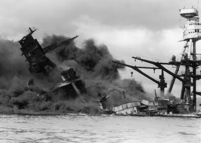 7th December 1941:  The USS Arizona sinking in a cloud of smoke after the Japanese attack on Pearl Harbor during World War II, Hawaii.  (Photo by Hulton Archive/Getty Images)