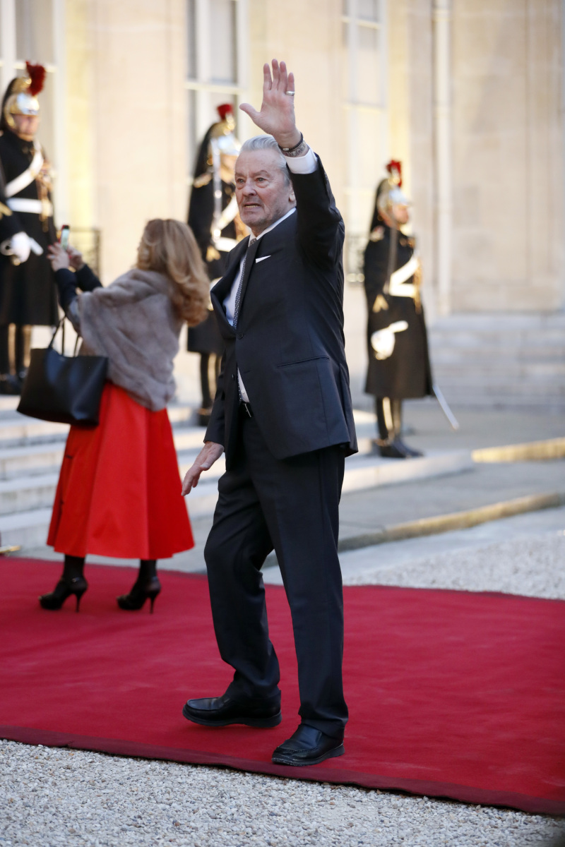 French actor Alain Delon arrives to attend a state dinner at the Elysee Palace, in Paris, Monday, March 25, 2019. Chinese President Xi Jinping is on a 3-day state visit in France where he is expected to sign a series of bilateral and economic deals on energy, the food industry, transport and other sectors. (AP Photo/Thibault Camus)