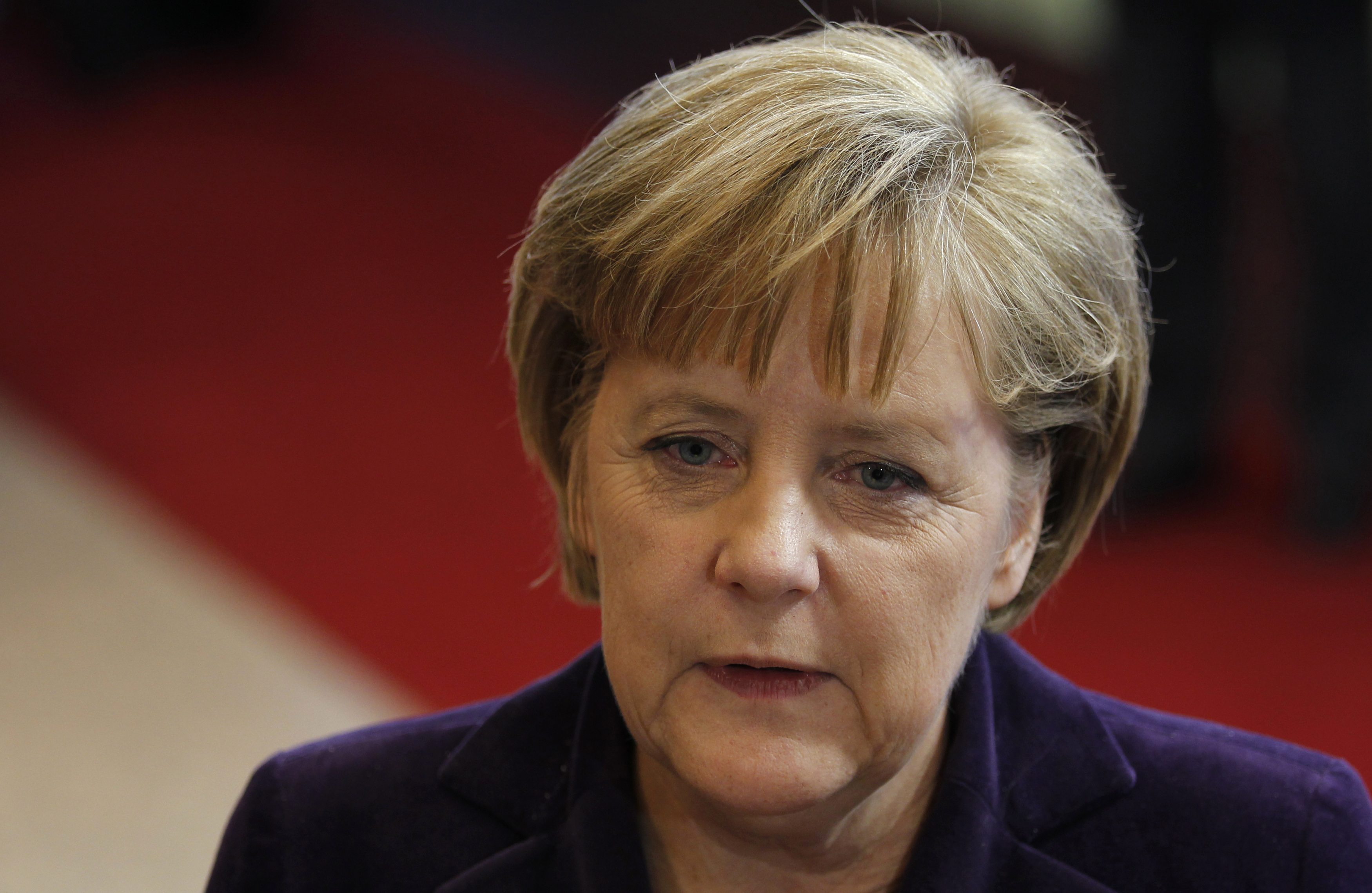 German Chancellor Angela Merkel talks to the media as she leaves an European Union leaders summit in Brussels December 16, 2010. EU leaders meet on Thursday to try to agree the next steps in tackling a year-long debt crisis that has consumed Greece and Ireland and threatens to spread to Portugal and Spain.  REUTERS/Francois Lenoir    (BELGIUM - Tags: POLITICS BUSINESS)