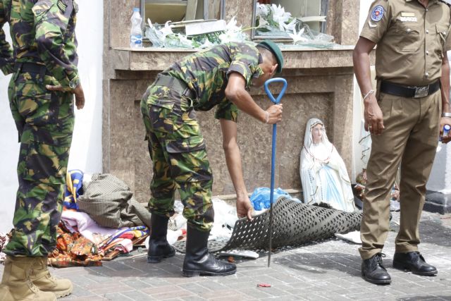 epa07518793 Security personal inspect the site after a explosion hit at St Anthony's Church in Kochchikade in Colombo, Sri Lanka, 21 April 2019. According to the news reports at least 25 people killed and over 200 injured in a series of blasts during the Easter Sunday service at St Anthony's Church in Kochchikade and explosions also reported at the Shangri-La Hotel and Kingsbury Hotel.  EPA/M.A. PUSHPA KUMARA