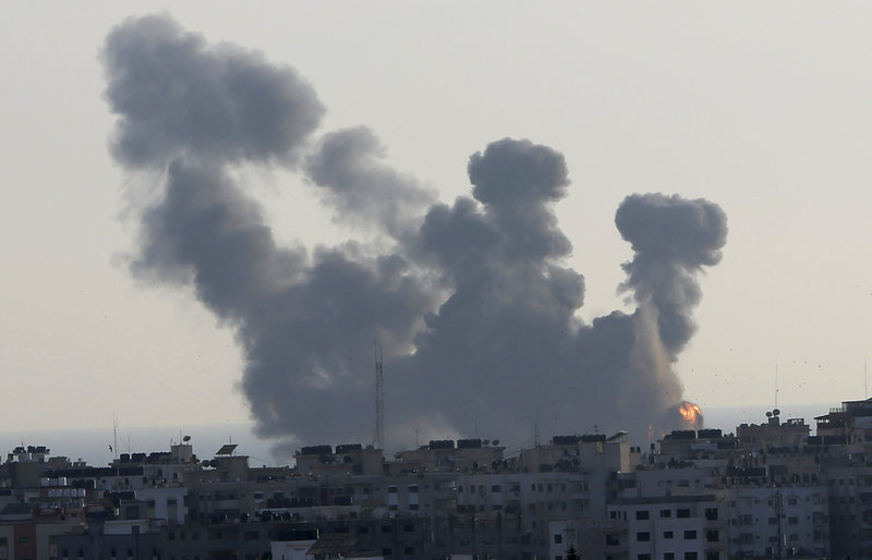 An explosion caused by Israeli airstrikes is seen in Gaza City, Saturday, May 4, 2019. Palestinian militants in the Gaza Strip fired scores of rockets into southern Israel on Saturday, wounding at least two Israeli civilians and triggering retaliatory airstrikes and tank fire against militant targets in the Hamas-ruled enclave and shattering a month-long lull in violence. (AP Photo/Adel Hana)