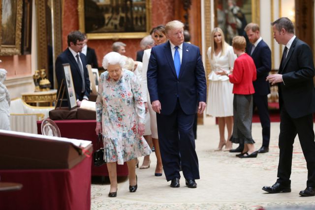 Britain's Queen Elizabeth II views a display of U.S. items of the Royal collection with U.S. President Donald Trump at Buckingham palace in London, Britain June 3, 2019. Ian Vogler/Pool via REUTERS