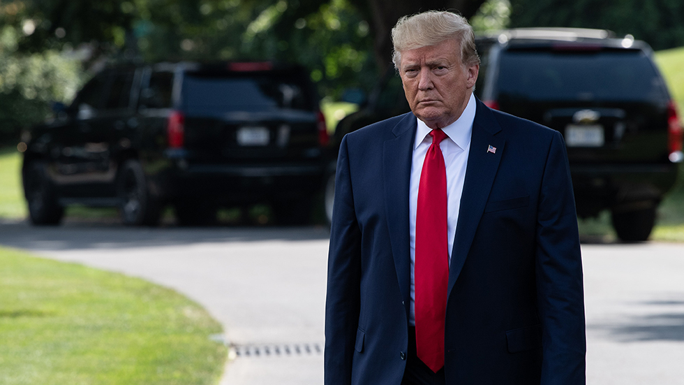 US President Donald Trump walks out of  the White House as he departs for Cincinnati to hold a campaign rally in Washington, DC, on August 1, 2019. (Photo by NICHOLAS KAMM / AFP)        (Photo credit should read NICHOLAS KAMM/AFP/Getty Images)