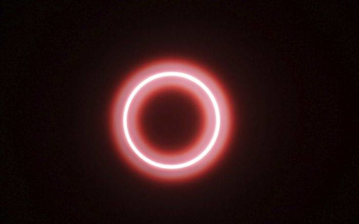 An annular solar eclipse is seen though safety glass from Siak, Riau province, Indonesia, Thursday, Thursday, Dec. 26, 2019. People along a swath of southern Asia gazed at the sky in marvel on Thursday at a "ring of fire" solar eclipse. (AP Photo/Rifka Majjid)