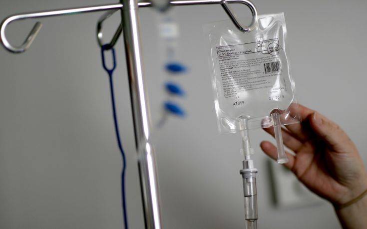 FILE- In this Feb. 9, 2018, file photo, a nurse hooks up an IV to a flu patient at Upson Regional Medical Center in Thomaston, Ga. Researchers found in a study of credit reports that more than 2 percent of adults had medical bills under $200 sent to a collections agency. More than half of the annual medical collections were for less than $600, according to the study, which examined 2016 credit reports for more than 4 million unidentified people. (AP Photo/David Goldman, File)