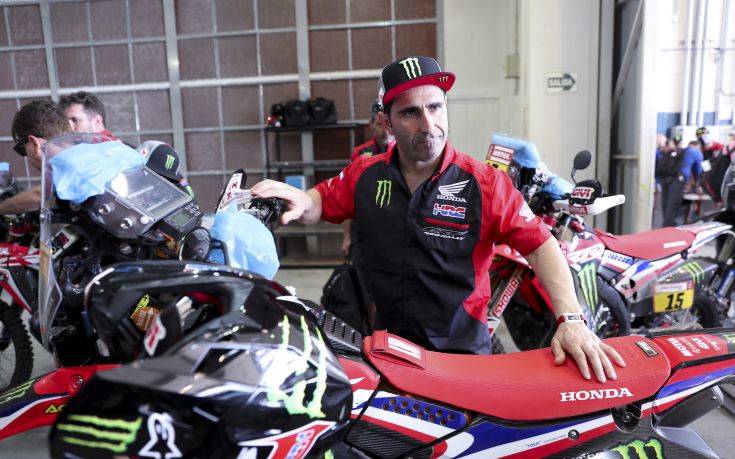 Paulo Goncalves of Portugal arrives with his Honda motorbike for technical checks for the 2019 Dakar Rally in Lima, Peru, Saturday, Jan. 5, 2019. The 41st edition of Dakar Rally will depart from Lima on Jan. 7. (AP Photo/Martin Mejia)