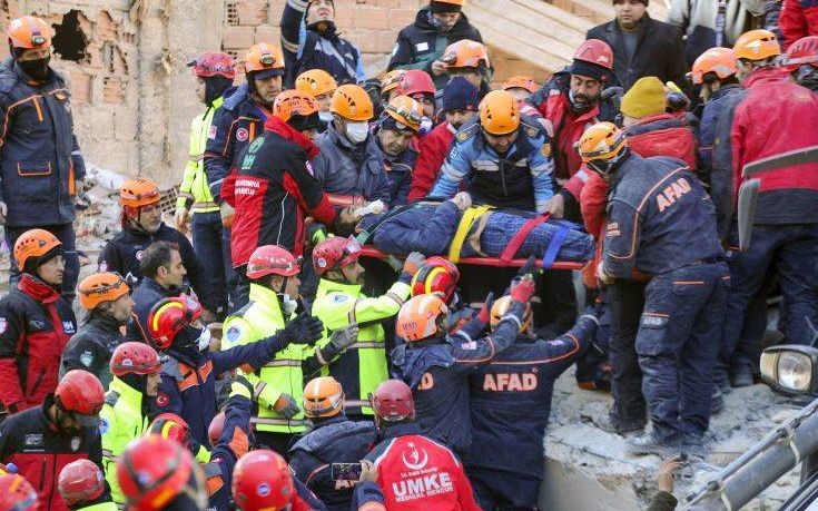 Rescuers work on a collapsed building after a strong earthquake struck in Elazig in the eastern Turkey, Saturday, Jan. 25, 2020. The earthquake rocked eastern Turkey on Friday, causing some buildings to collapse and killing scores of people, Turkish officials said. (IHA via AP)