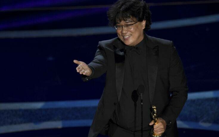 Bong Joon Ho accepts the award for best director for "Parasite" at the Oscars on Sunday, Feb. 9, 2020, at the Dolby Theatre in Los Angeles. (AP Photo/Chris Pizzello)