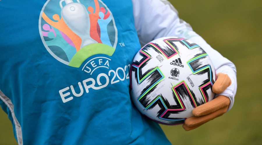 FILE PHOTO: UEFA Euro 2020 mascot Skillzy poses for a photo with the official match ball at Olympiapark in Munich, Germany, March 3, 2020. REUTERS/Andreas Gebert/File Photo