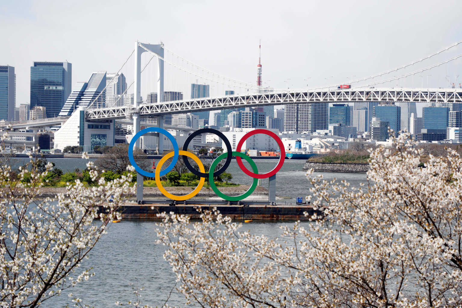 Mar 24, 2020; Tokyo, Japan; Olympic rings monument at Rainbow Bridge, Odaiba, Tokyo. On Monday the IOC announced that the Tokyo 2020 Summer Olympics Games would be postponed due to the COVID-19 coronavirus pandemic. Mandatory Credit: Yukihito Taguchi-USA TODAY Sports