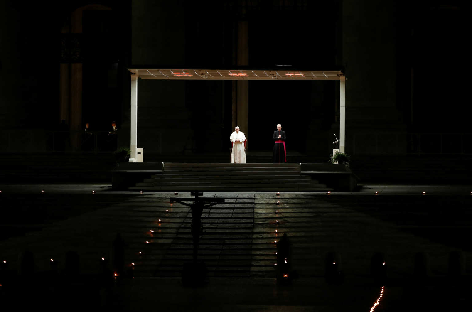 Pope Francis leads the Via Crucis (Way of the Cross) procession during Good Friday celebrations at St. Peter's Square with no public participation due to an outbreak of the coronavirus disease (COVID-19) in Vatican, April 10, 2020. REUTERS/Yara Nardi