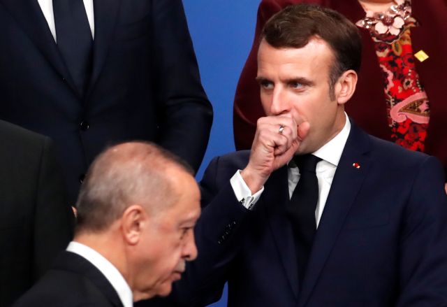 France's President Emmanuel Macron gestures next to Turkey's President Recep Tayyip Erdogan during a photo opportunity at the NATO leaders summit in Watford, Britain December 4, 2019. REUTERS/Christian Hartmann/Pool