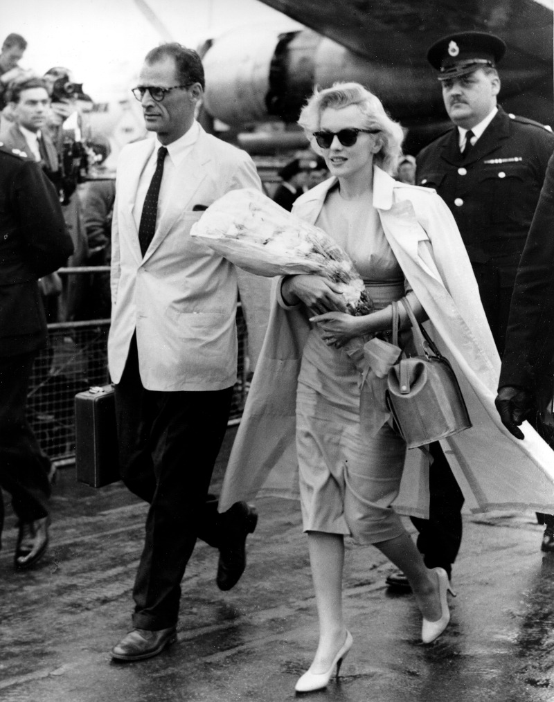 Hollywood actress Marilyn Monroe and her husband, playwright Arthur Miller, arrive from New York at London airport, England, July 14, 1956.  Monroe is in Britain to work on a movie.  (AP Photo)