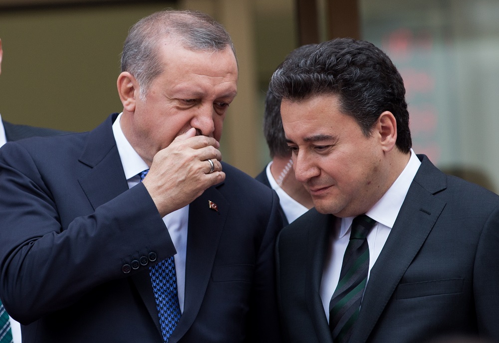 epa07703535 (FILE) - Turkish President Recep Tayyip Erdogan (L) chats with then Deputy Prime Minister of Turkey Ali Babacan during the opening ceremony of the Ziraat Katilim Bank (participation bank), in Istanbul, Turkey, 29 May 2015 (reissued 08 July 2019). Reports on 08 July 2019 state Ali Babacan, former ally of Turkish President Recep Tayyip Erdogan has said he would resign from the AK party.  EPA/SEDAT SUNA