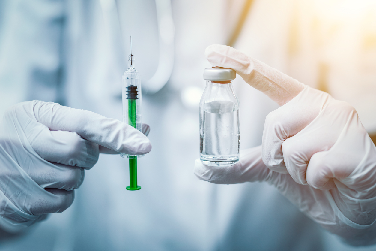 Syringe, medical injection in hand. Vaccination equipment with needle.